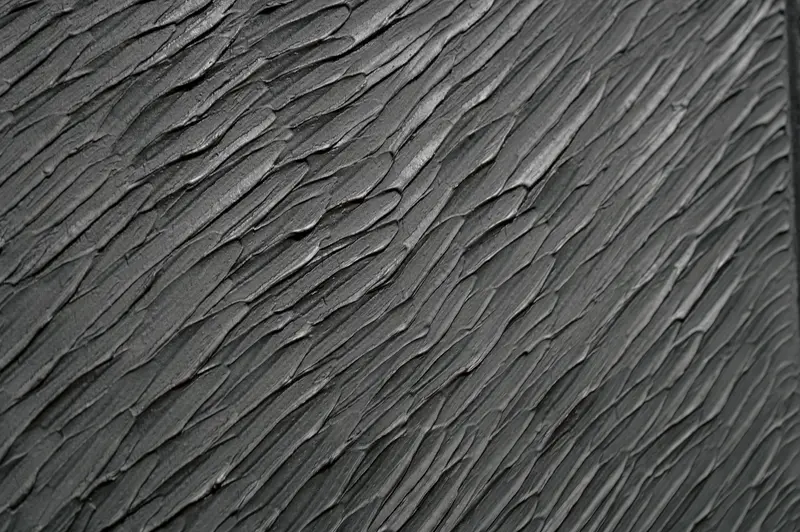 Textured Surface with Parallel Linear Ridges and Erosion Patterns