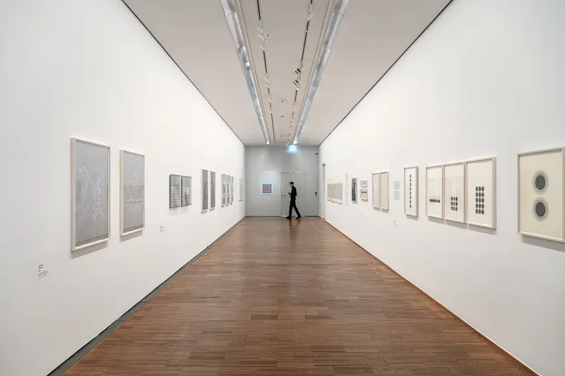 Contemporary Art Gallery Exhibition with Framed Works on Display