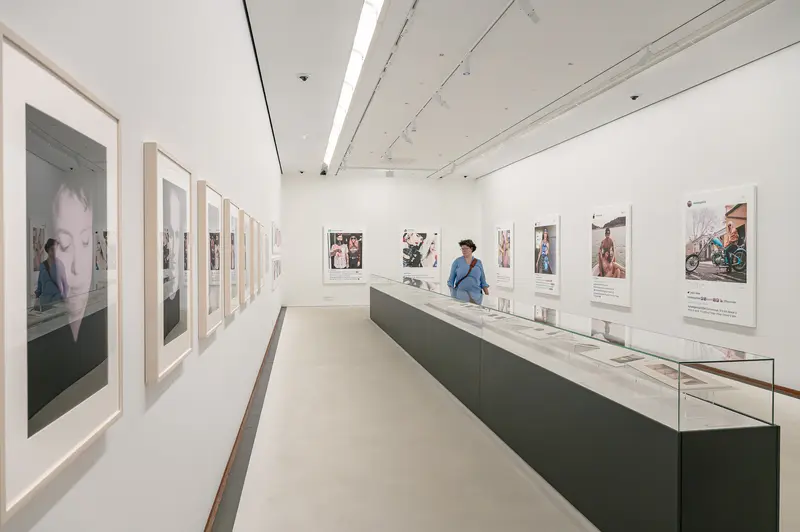 Contemporary Photography Exhibition with Framed Portraits and Display Cases