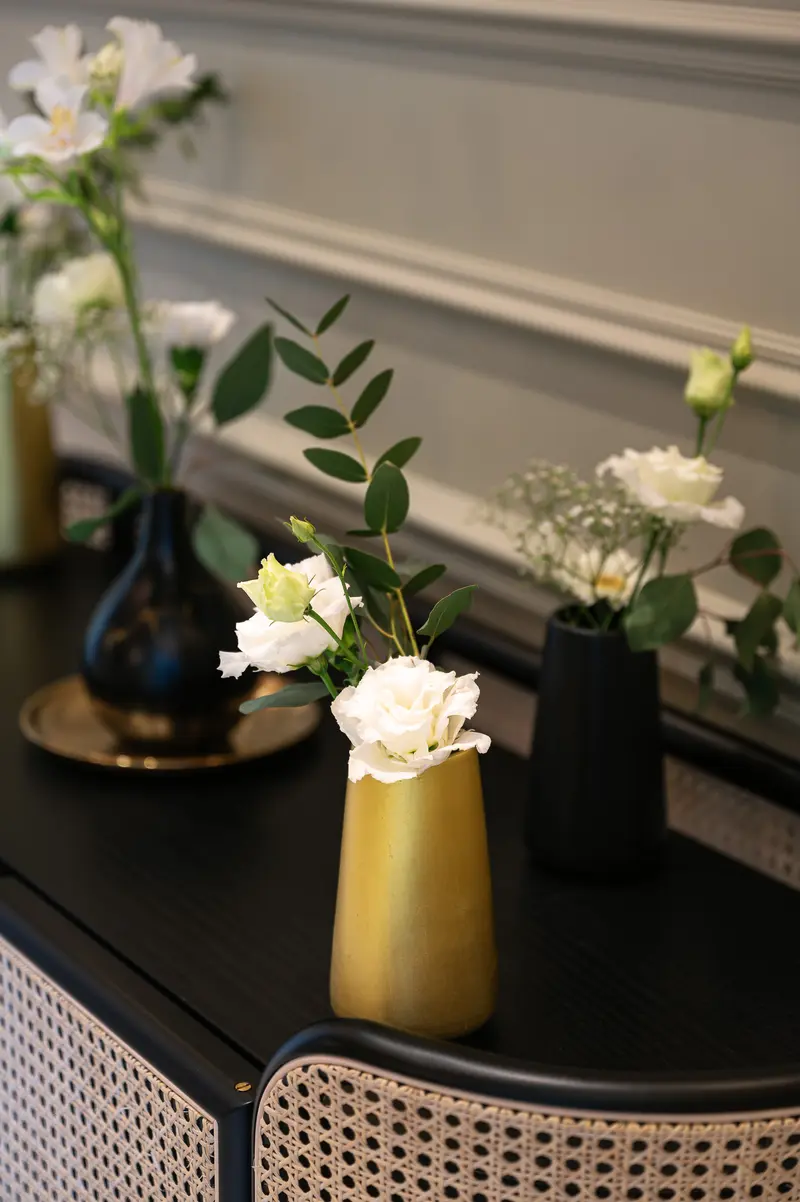 Floral Arrangements in Gold and Black Vases at Palais Chotek Vienna