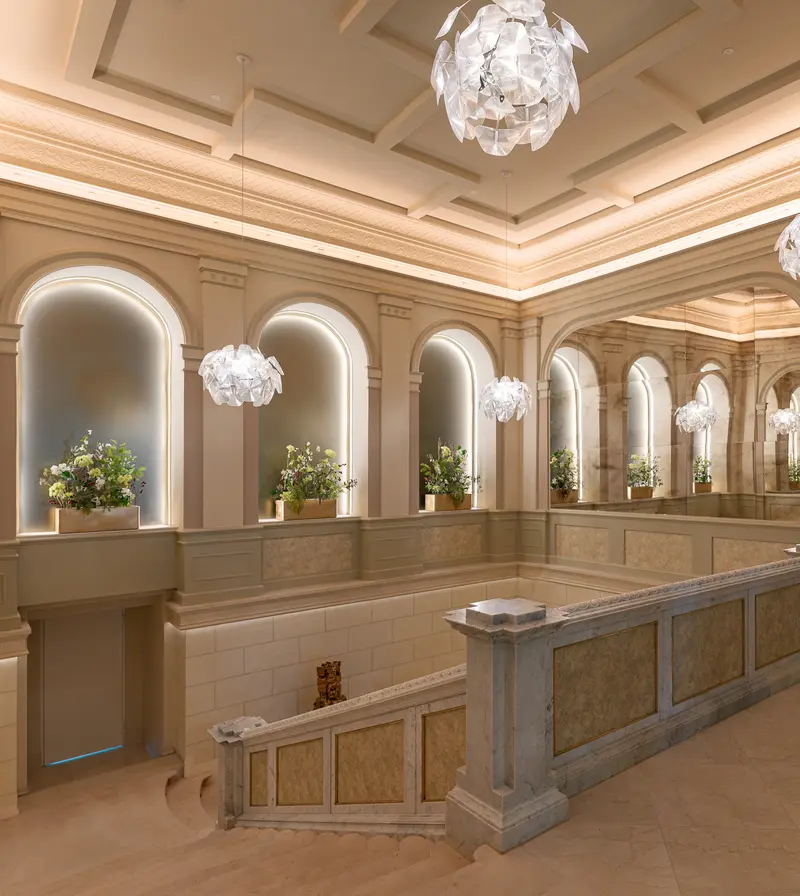 Palais Chotek Vienna Restroom Gallery with Arched Mirrors and Crystal Pendant Lights