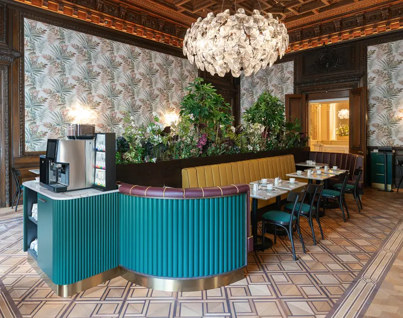Palais Chotek Vienna Restaurant Interior with Turquoise Bar Counter