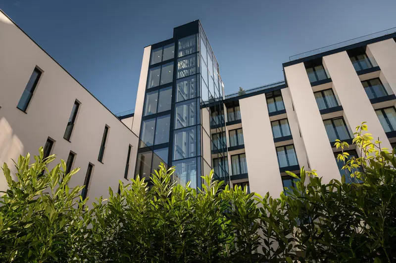 Modern Residential Complex with Central Glass Tower at IgersWalk Vienna