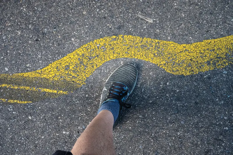 Cracked Yellow Lane Marking on Frankstahl Guntramsdorf Yard Asphalt