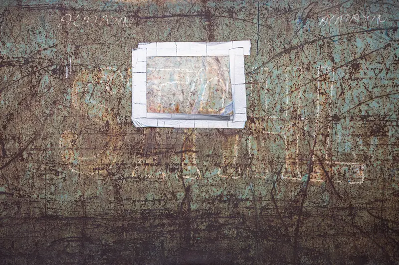 Weathered Steel Surface with Taped Paper Label at Frankstahl