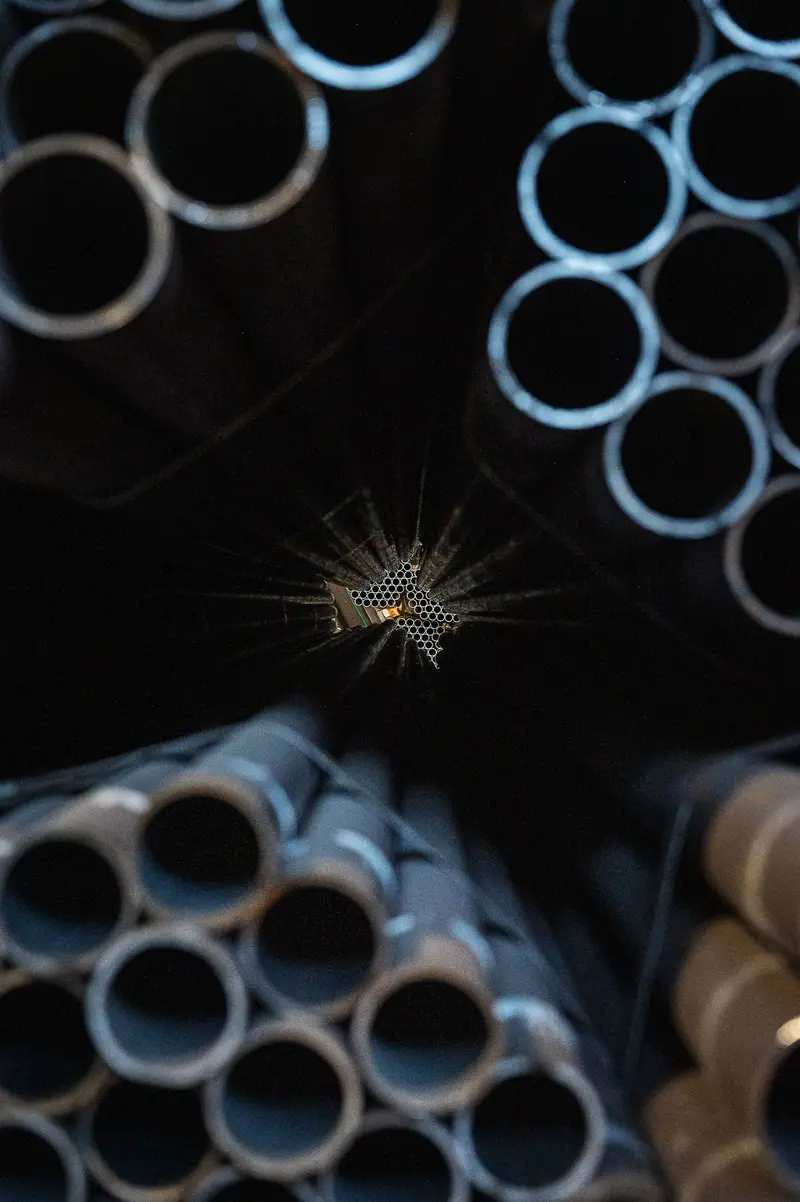 Light Starburst Through Steel Pipe Bore at Frankstahl Guntramsdorf
