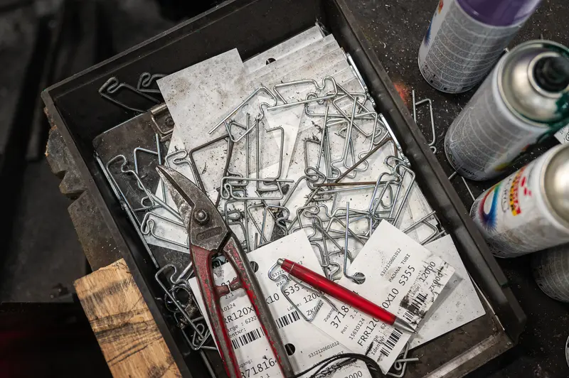 Steel workshop tray with wire clips, tin snips, barcoded labels and spray cans