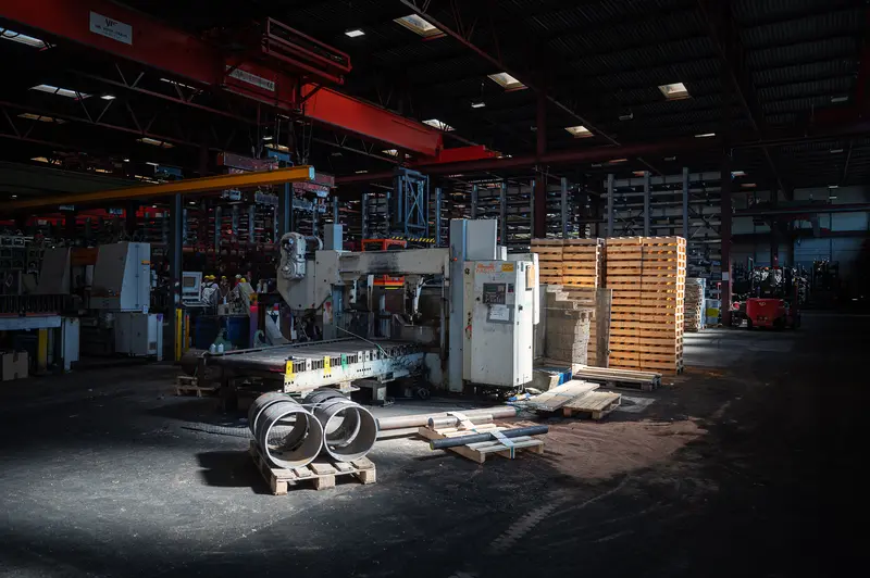 Automated Processing Hall with Overhead Crane and Cut Pipe Sections