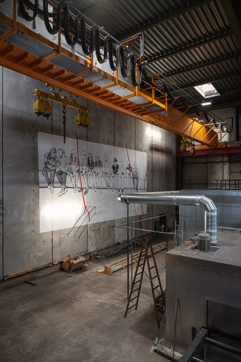 Large-Format Mural on Warehouse Wall Beneath Yellow Overhead Crane