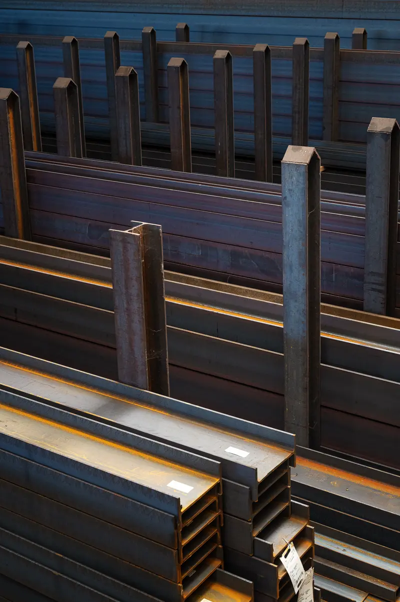 Stacked Steel I-Beams and H-Sections in Frankstahl Guntramsdorf Warehouse