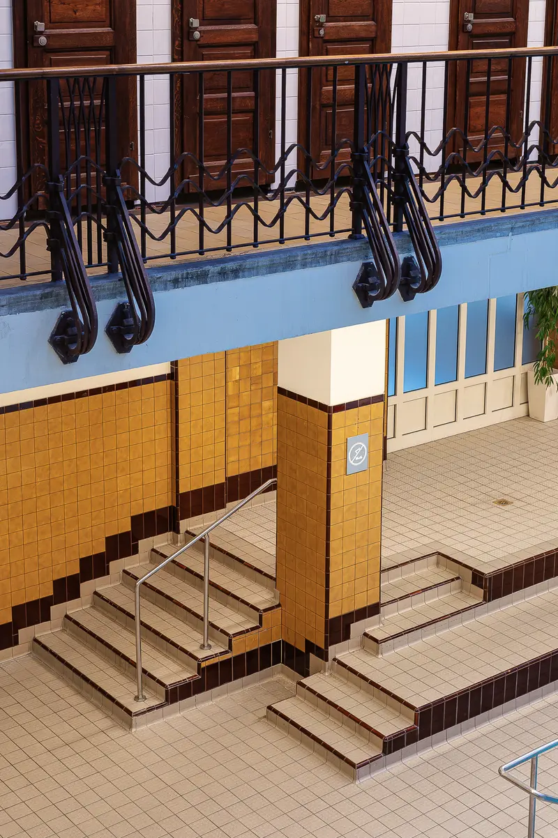 Amalienbad Interior Staircase with Art Deco Tilework and Wrought-Iron Balcony
