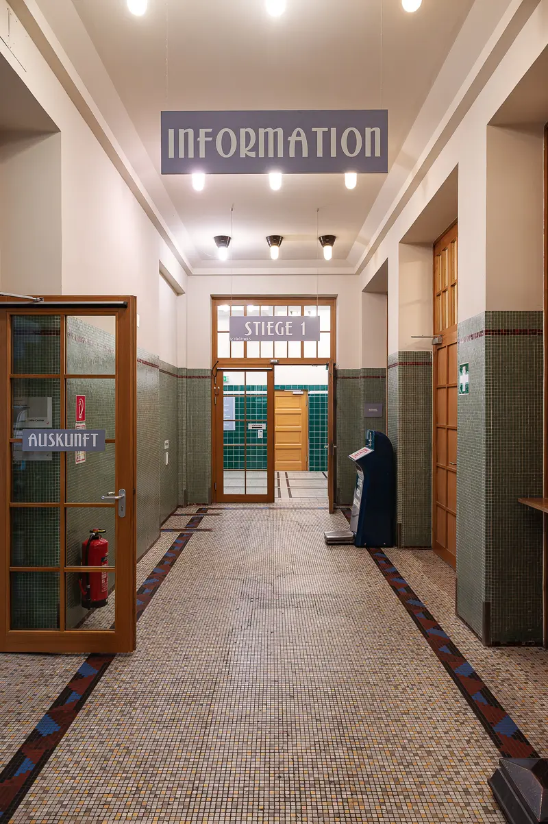 Amalienbad Entry Corridor with Information Desk and Tiled Floor