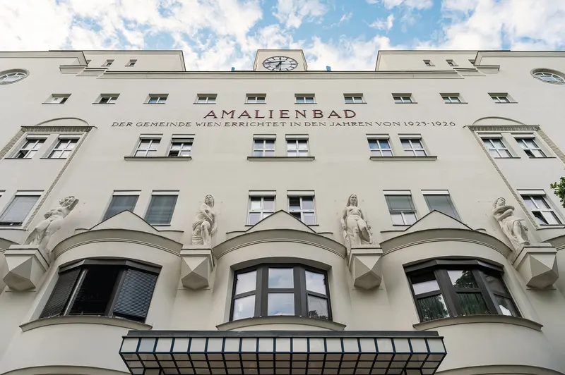 Amalienbad exterior facade with inscription and allegorical sculptures, Vienna