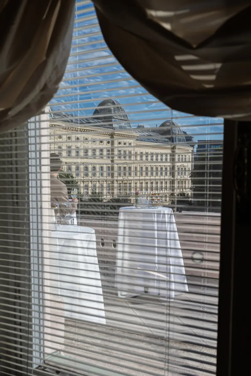View Through Venetian Blinds Toward Historic Neoclassical Building