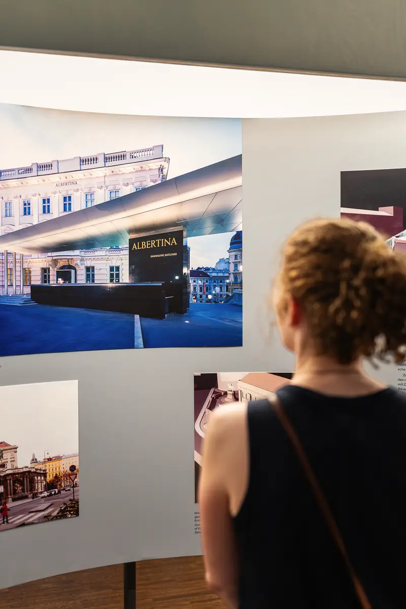 Visitor Viewing Albertina Museum Photo at Exhibition Display