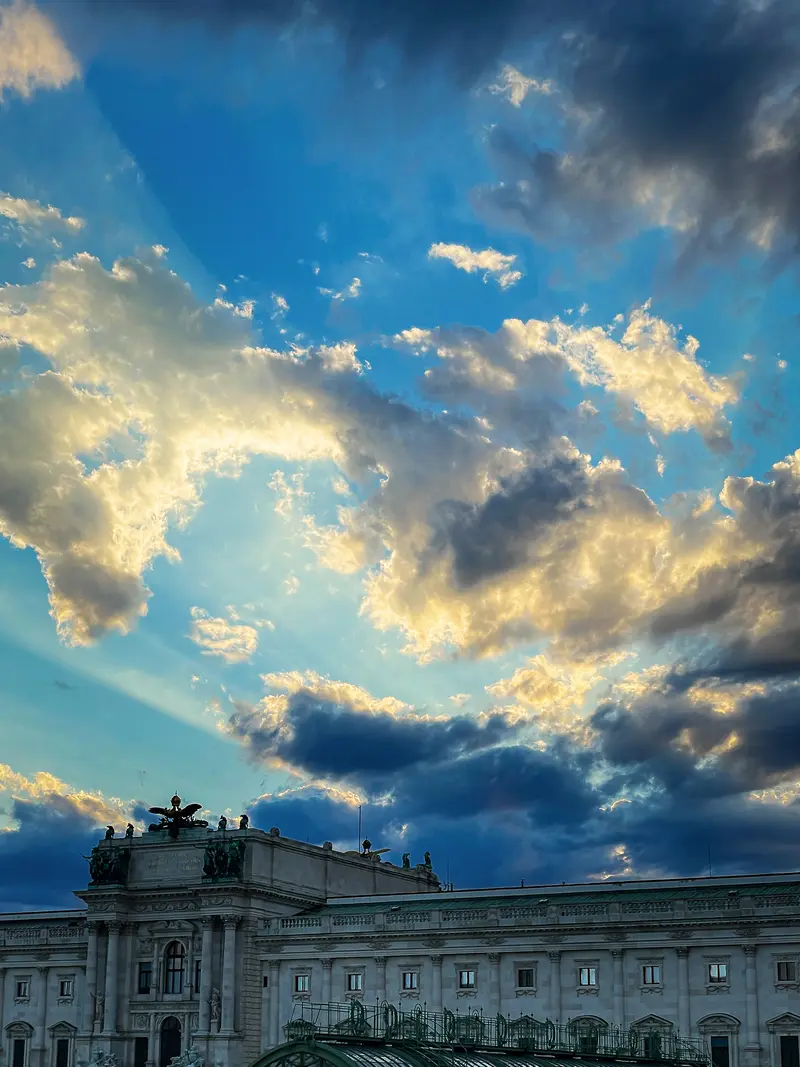 Dramatic Sunset Sky Over Vienna Hofburg Palace Roofline