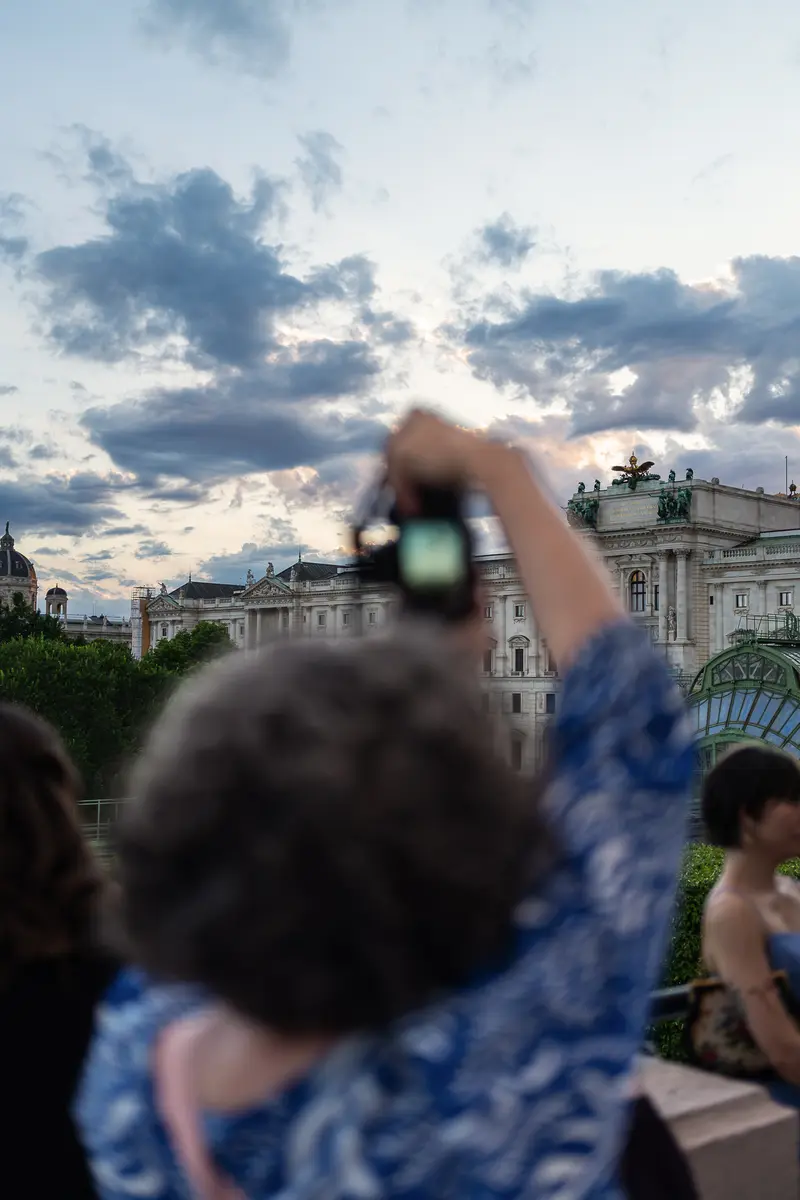 Visitor Photographing the Burgtheater at Dusk, Vienna