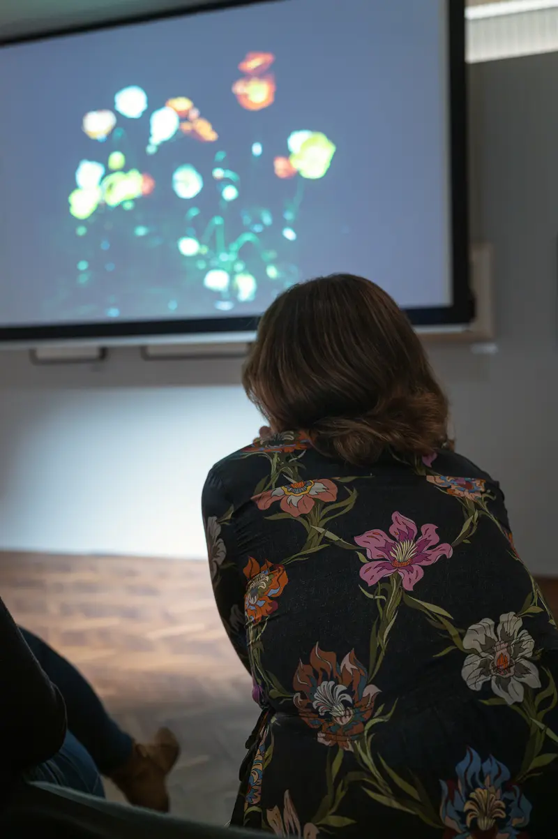 Audience Member Watches Projected Floral Image, Cig Harvey at Leica Gallery Vienna, Sep 29th, 2026