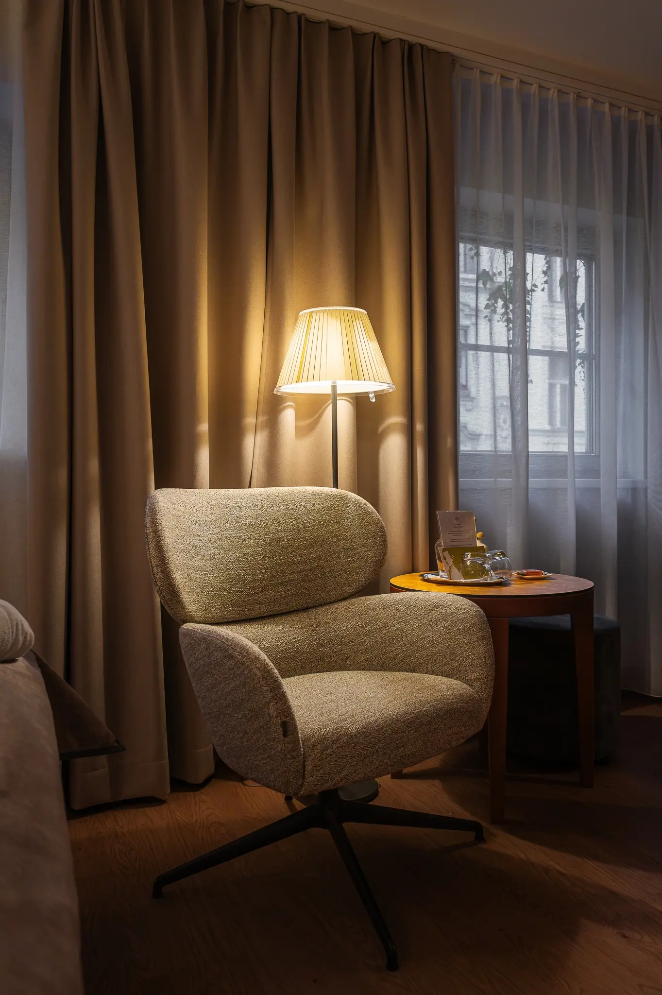 Guest Room Seating Corner with Swivel Armchair at Hotel Das Tigra, Vienna