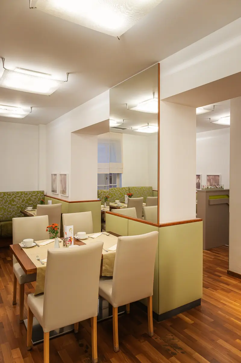 Breakfast Room with Green Banquettes and Mirrored Partition at Hotel Das Tigra, Vienna