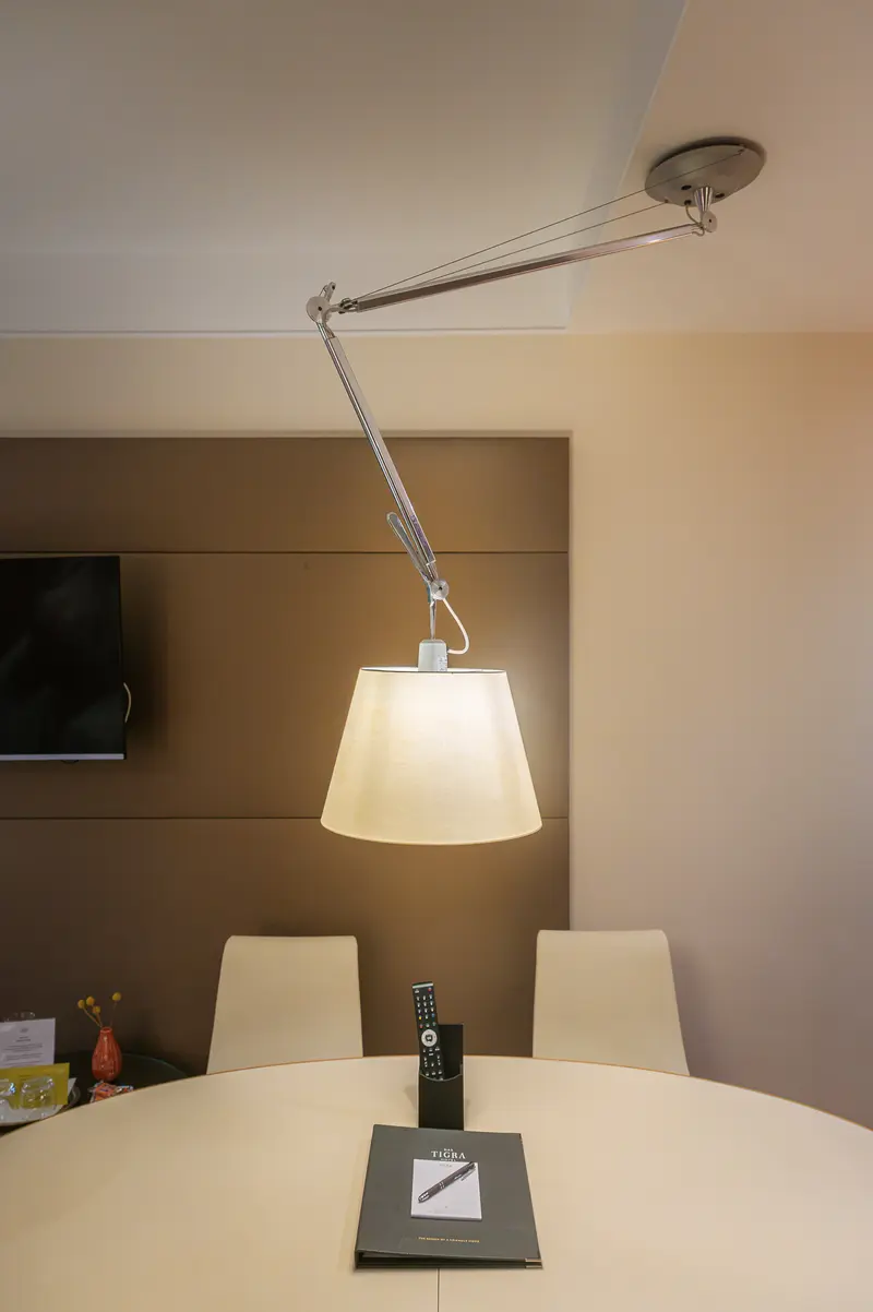 Adjustable Tolomeo-Style Ceiling Lamp Over Guest Room Table, Hotel Das Tigra Vienna