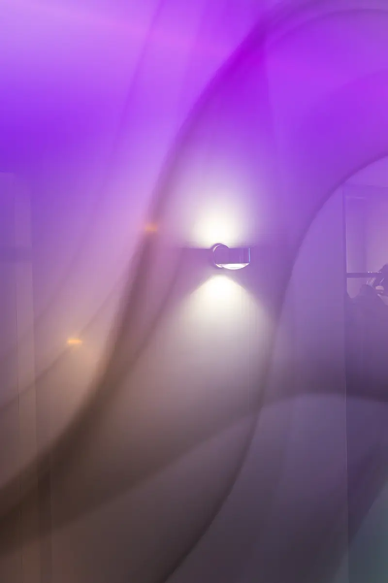Purple-lit wall sconce behind sheer curtain, Hotel Das Tigra, Tiefer Graben, Vienna