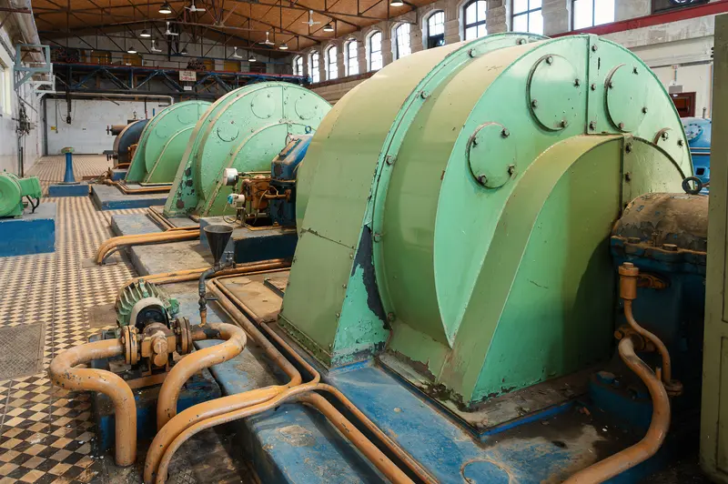 Green machine housings in the historic Glanzstoff turbine hall, St. Pölten Open House 2026