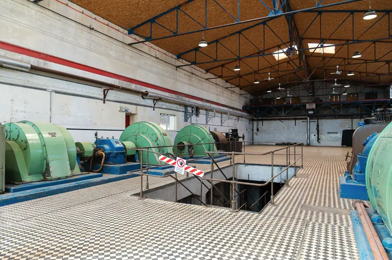 Industrial hall with green machinery and checkerboard tile floor, Glanzstoff St. Pölten Open House 2026