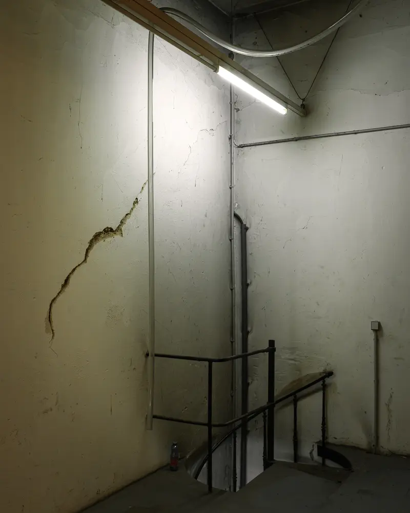 Stairwell Opening with Iron Railing and Cracked Plaster, Glanzstoff St. Pölten Open House 2026