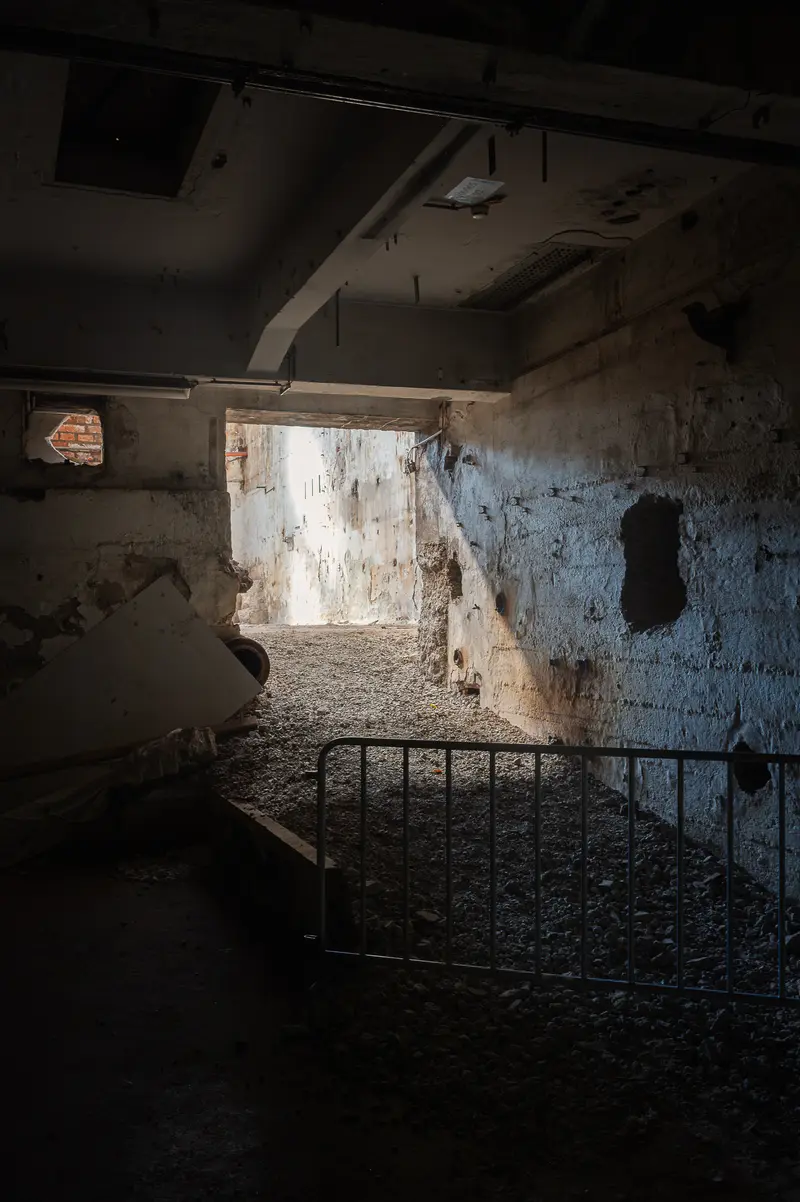 Gutted concrete hall with crowd barrier at Glanzstoff St. Pölten Open House 2026