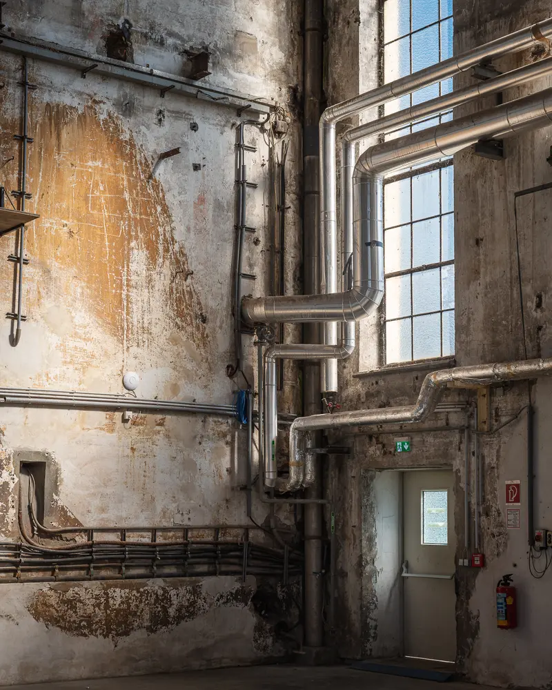 Exposed Pipework and Weathered Concrete Hall Interior, Glanzstoff St. Pölten Open House 2026