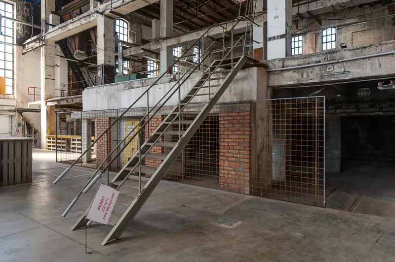 Steel stair and mesh barrier in Glanzstoff factory hall, Open House 2026 St. Pölten