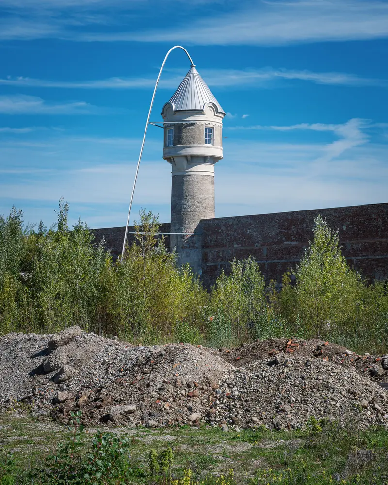Historic water tower above rubble mounds at Glanzstoff St. Pölten Open House 2026