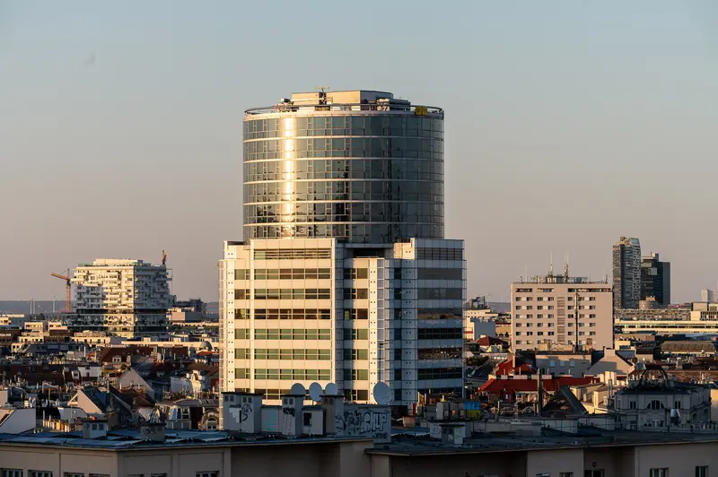 Vienna Rooftops and Glass-Crowned High-Rise During the 12 August 2026 Partial Solar Eclipse