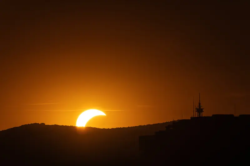 Crescent Sun Setting Behind Wienerwald Hills During Vienna's Solar Eclipse, 12 August 2026