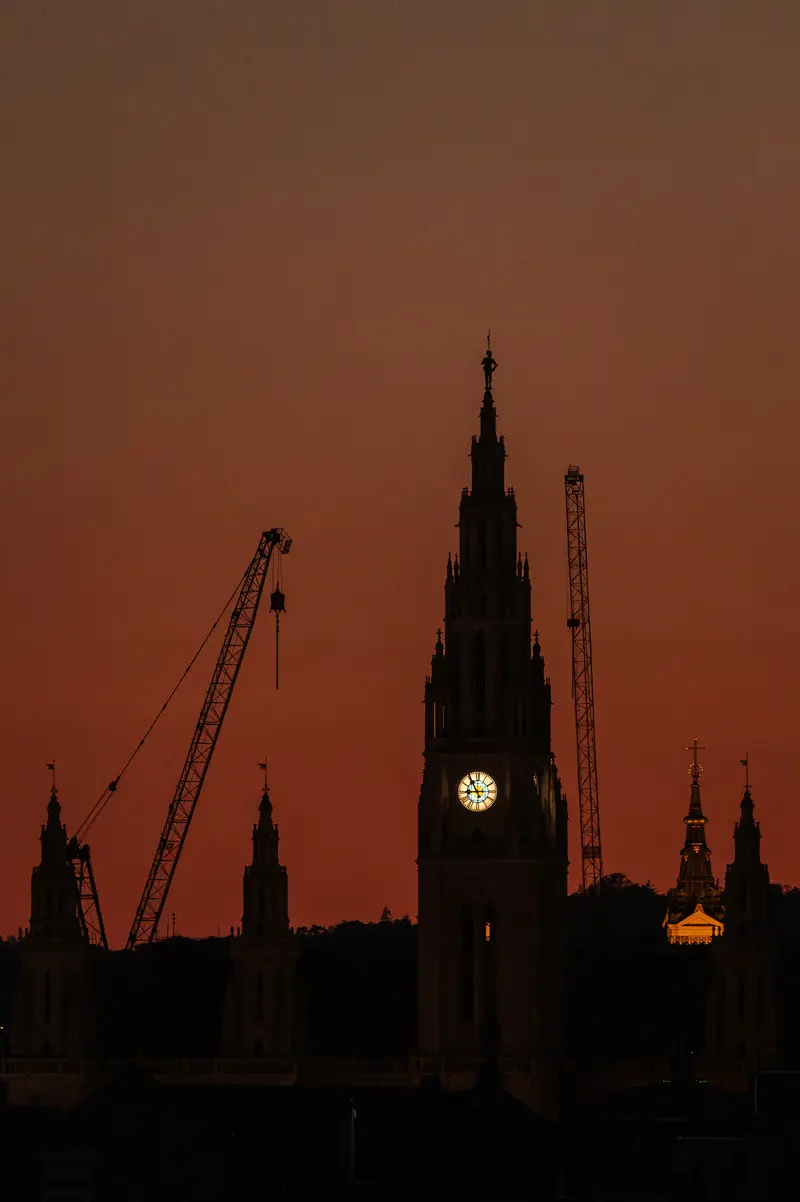 Vienna City Hall Tower Silhouetted Against Red Sky During August 2026 Solar Eclipse