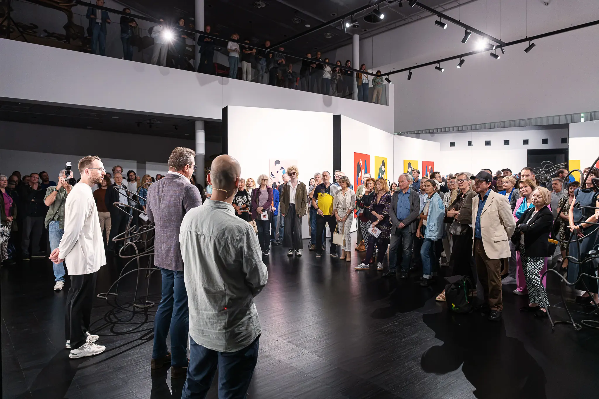 Opening speeches before a crowd at Marko Sajn "Becoming One" at Strabag Art Site