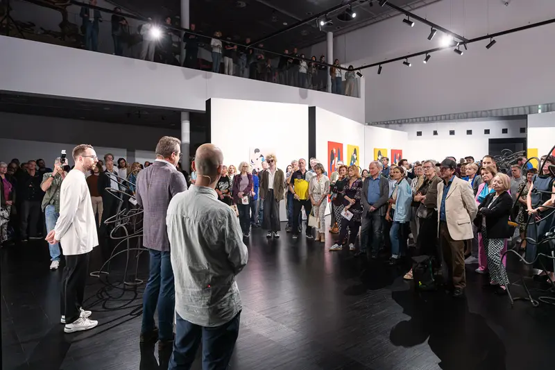 Opening speeches before a crowd at Marko Sajn "Becoming One" at Strabag Art Site