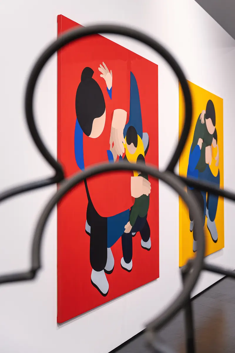 Marko Sajn paintings seen through a black wire sculpture at "Becoming One", Strabag Art Site