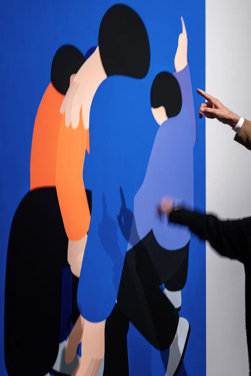 Two hands pointing at Marko Sajn painting at "Becoming One" opening, Strabag Art Site